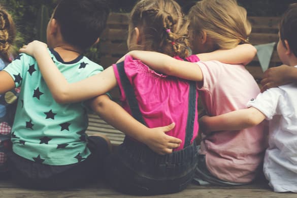 young students embracing at a school field trip