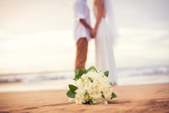 a happy couple kiss on a Tampa beach