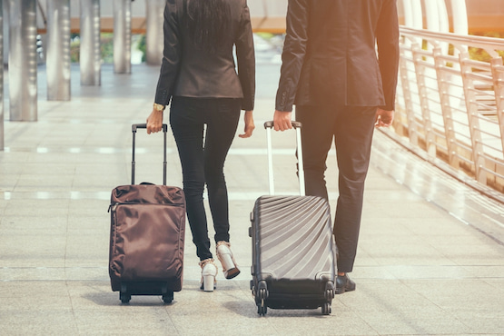 to colleagues with suitcases attend a Tampa corporate event